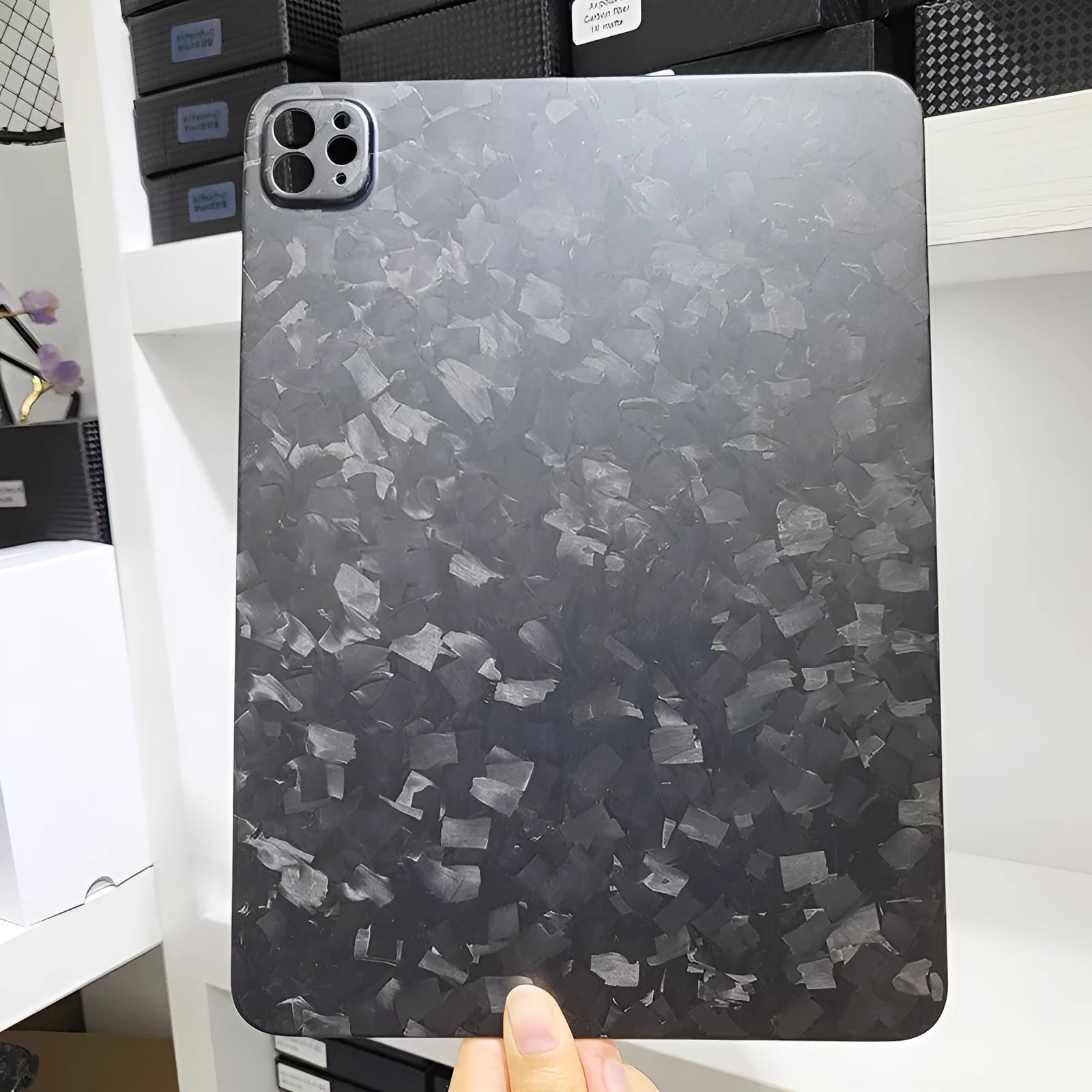 Flat carbon fibre hard protective case for Apple iPad Pro 11 tablet in a textured finish.
