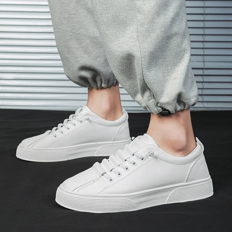 Men's black and white low top sports shoes with mesh panels and synthetic leather upper.