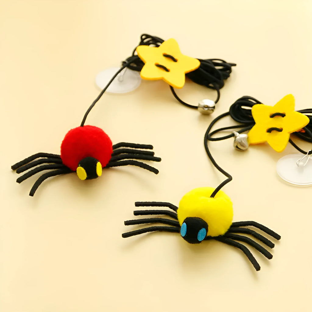 Hanging door cat toy with elastic rope, feather and bell spider accessory in red colour