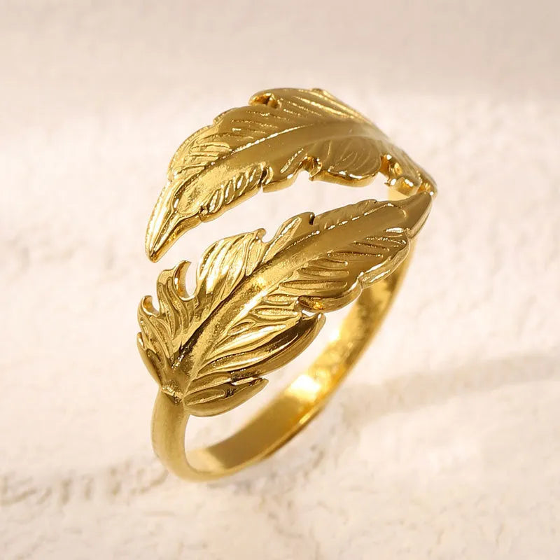 Adjustable titanium steel feather ring with silver electroplated finish on female hand